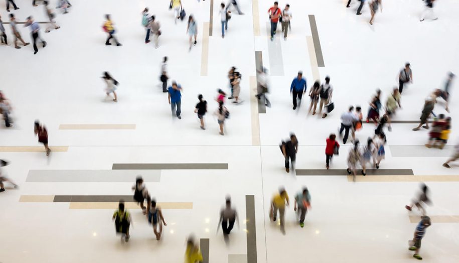 Groups of people walking in a building